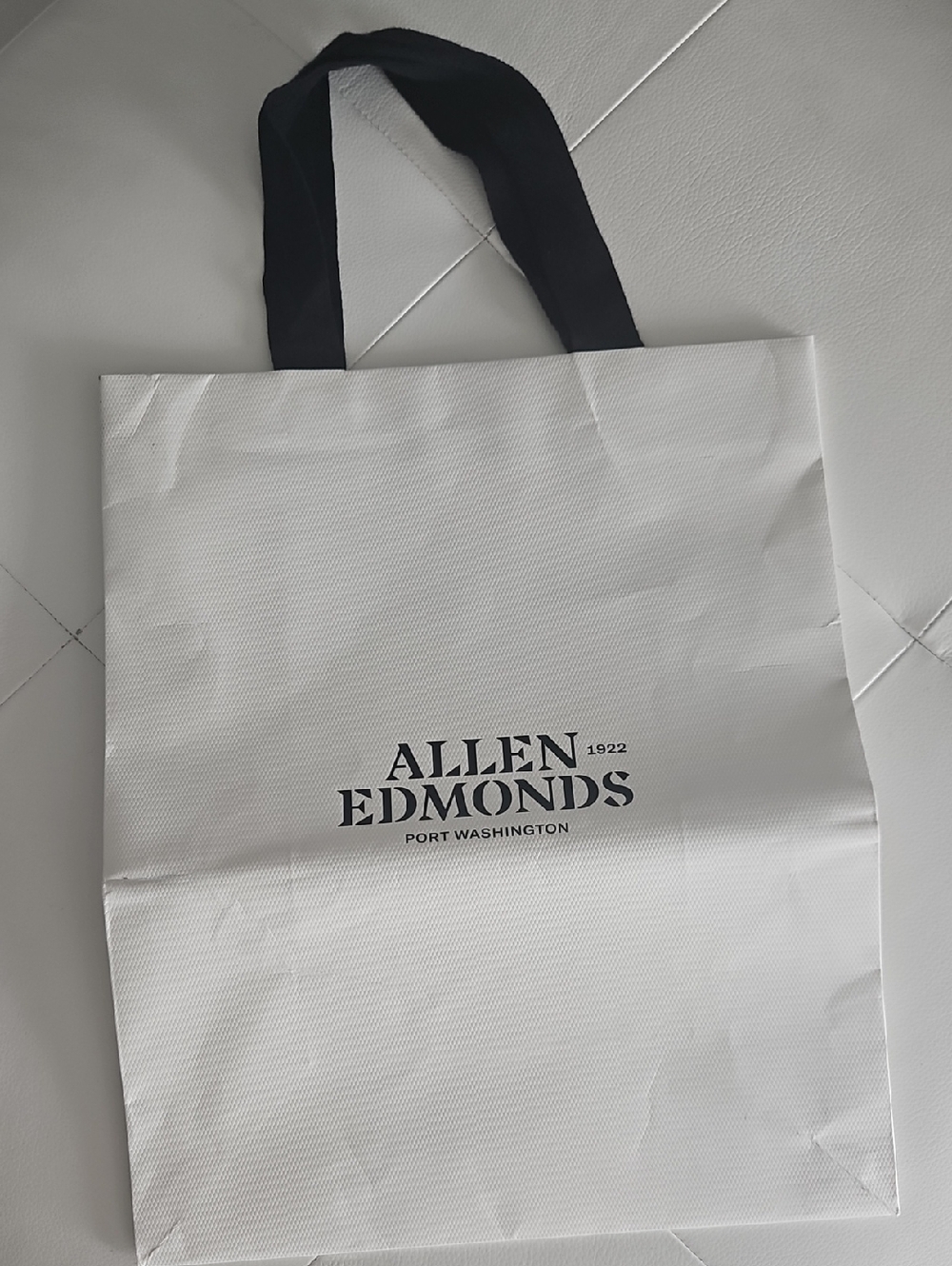 Allen Edmonds White Shoppinh Bag with Black Handles and Logo